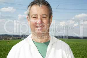 Portrait of farmer in front of his box