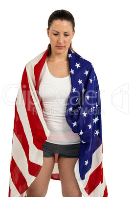 Athlete with american flag wrapped around his body