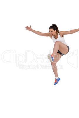 Athletic woman running on white background