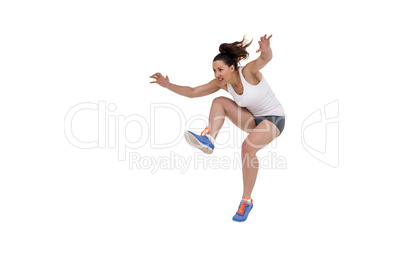 Athletic woman running on white background