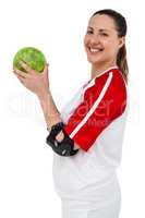 Sportswoman posing with ball