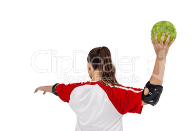 Sportswoman throwing a ball