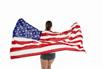 Athlete posing with american flag after victory