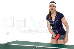 Female athlete playing table tennis