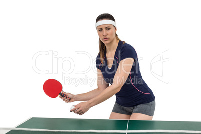 Female athlete playing table tennis