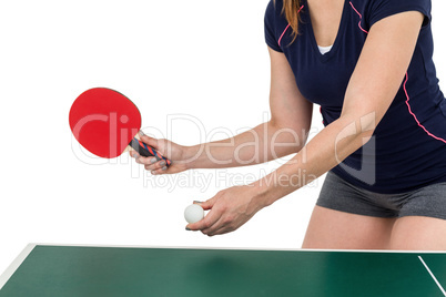 Female athlete playing table tennis