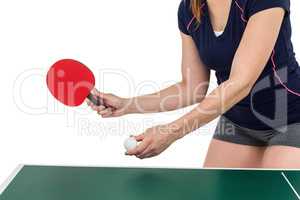 Female athlete playing table tennis