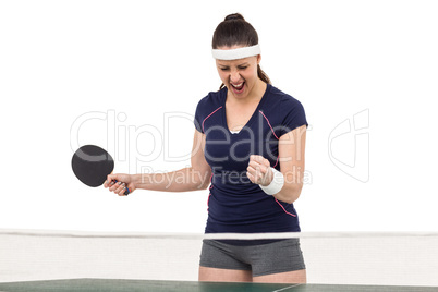 Female table tennis player posing after victory