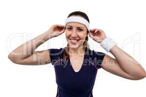 Female athlete wearing headband and wristband