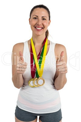 Athlete posing with gold medals around his neck