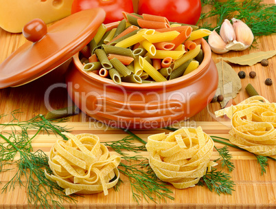 pasta, cheese and spices on the board