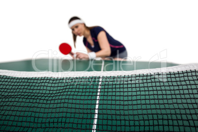 Female athlete playing table tennis