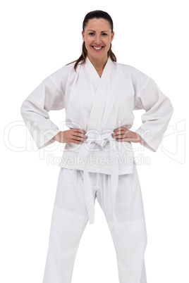 Female fighter standing with hand on hip