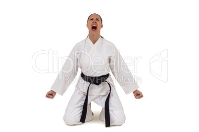 Female fighter posing after victory