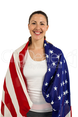 Female athlete with american flag wrapped around his body
