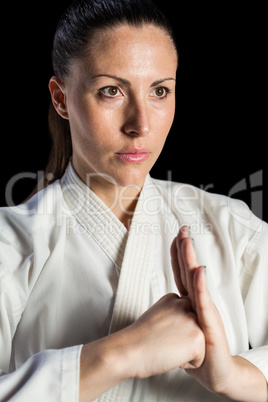 Female fighter performing hand salute