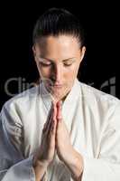 Close-up of female karate fighter meditating