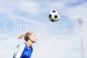 Female football player playing football