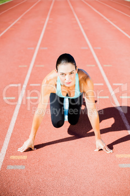 Portrait of female athlete ready to run