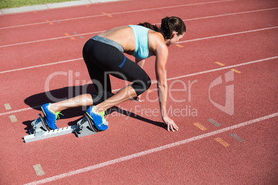 Female athlete ready to run