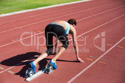 Female athlete ready to run