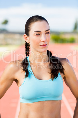 Confident female athlete in sportswear