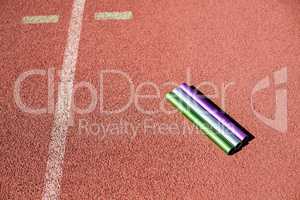 Relay baton on running track