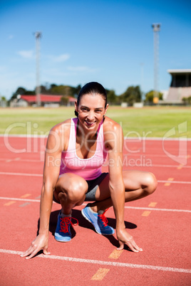 Portrait of happy female athlete warming up Portrait of happy female athlete warming up