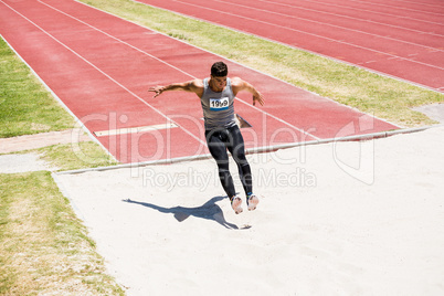 Athlete performing a long jump