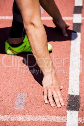 Athletes hands on a starting block