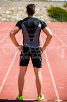 Athlete standing on running track