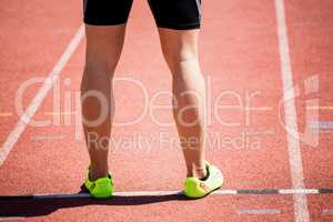 Feet of an athlete on running track
