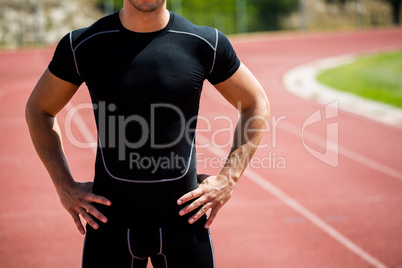 Athlete standing on running track
