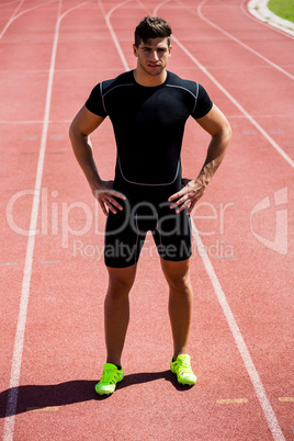 Athlete standing on running track