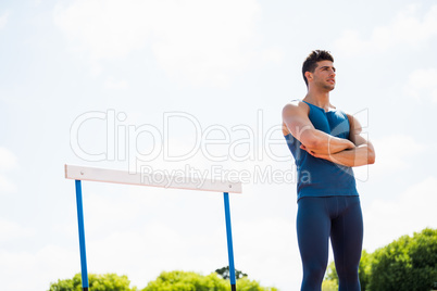 Athlete standing with arms crossed