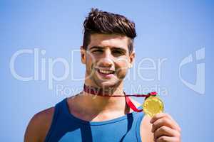 Athlete showing his gold medal