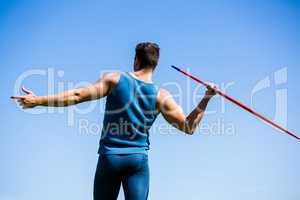 Rear view of an athlete about to throw a javelin