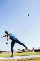 Athlete throwing discus in stadium