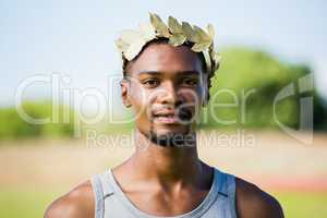 Athlete wearing green roman laurel wreath