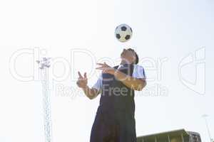 Football player practicing soccer