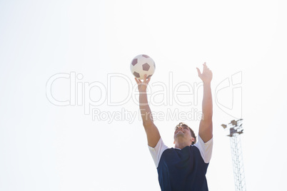 Football player practicing soccer