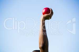 Athletes hand performing shot put