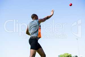 Athlete throwing shot put ball