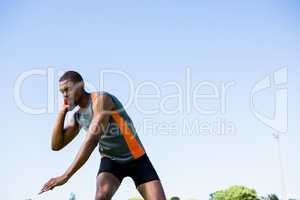 Athlete about to throw shot put ball