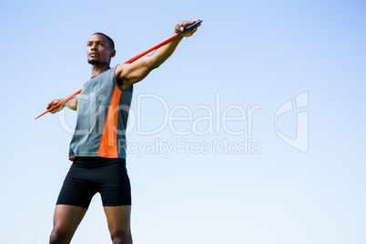 Athlete carrying javelin on his shoulder