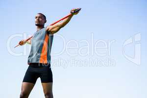 Athlete carrying javelin on his shoulder