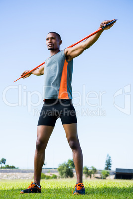 Athlete carrying javelin on his shoulder