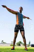 Athlete carrying javelin on his shoulder