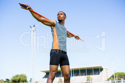 Athlete carrying javelin on his shoulder