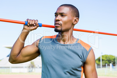 Athlete holding javelin on his shoulder